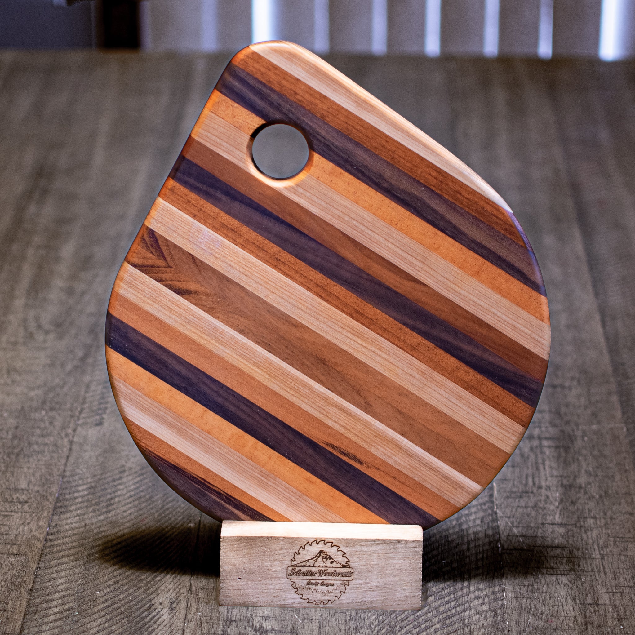 Teardrop7WoodtCutting Board in Che ry,7Curly7Maple, orsWalnut offers